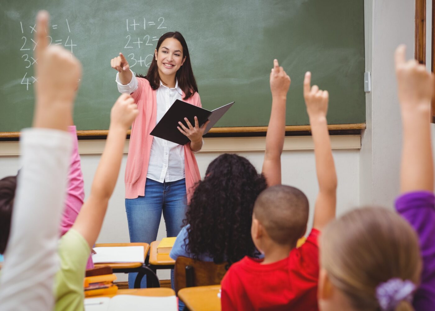 Teacher asking her students a question